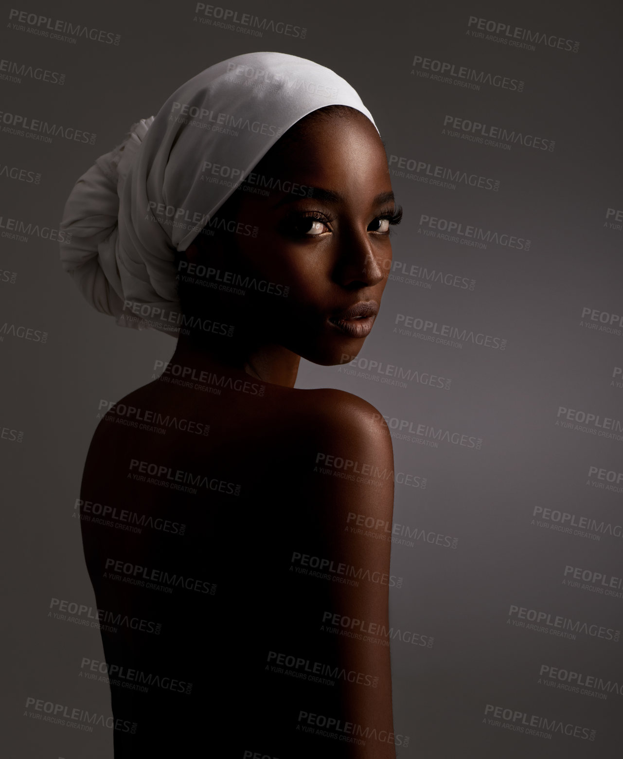 Buy stock photo Portrait, beauty and culture with natural black woman in studio on gray background for wellness. Skincare, heritage and tradition with back of young person in headwear for cosmetics or dermatology