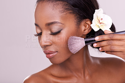 Buy stock photo Cosmetic glow, makeup brush on face and black woman with skincare in studio, cosmetics tool. Skin care, blush and foundation, African beauty model with luxury contour highlight on pink background