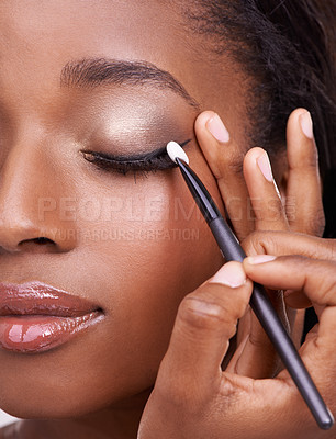 Buy stock photo Closeup of black woman, brush and eyeshadow with makeup, beauty and lashes with eyeliner. Skin glow, hands and cosmetic product application with tools for cosmetology, shimmer or glitter with shine