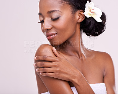 Buy stock photo Skincare, cosmetics and black woman with flower in studio with beauty, wellness and face care. Salon aesthetic, dermatology and isolated person for natural skin, spa and facial on white background