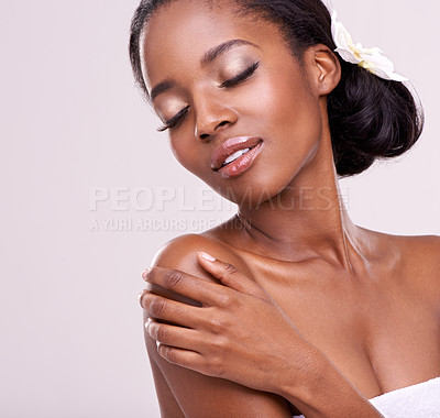 Buy stock photo Woman, face and orchid for skincare in studio with beauty, natural glow and self care with confidence. Model, african person or flower for cosmetology, facial treatment or makeup on white background