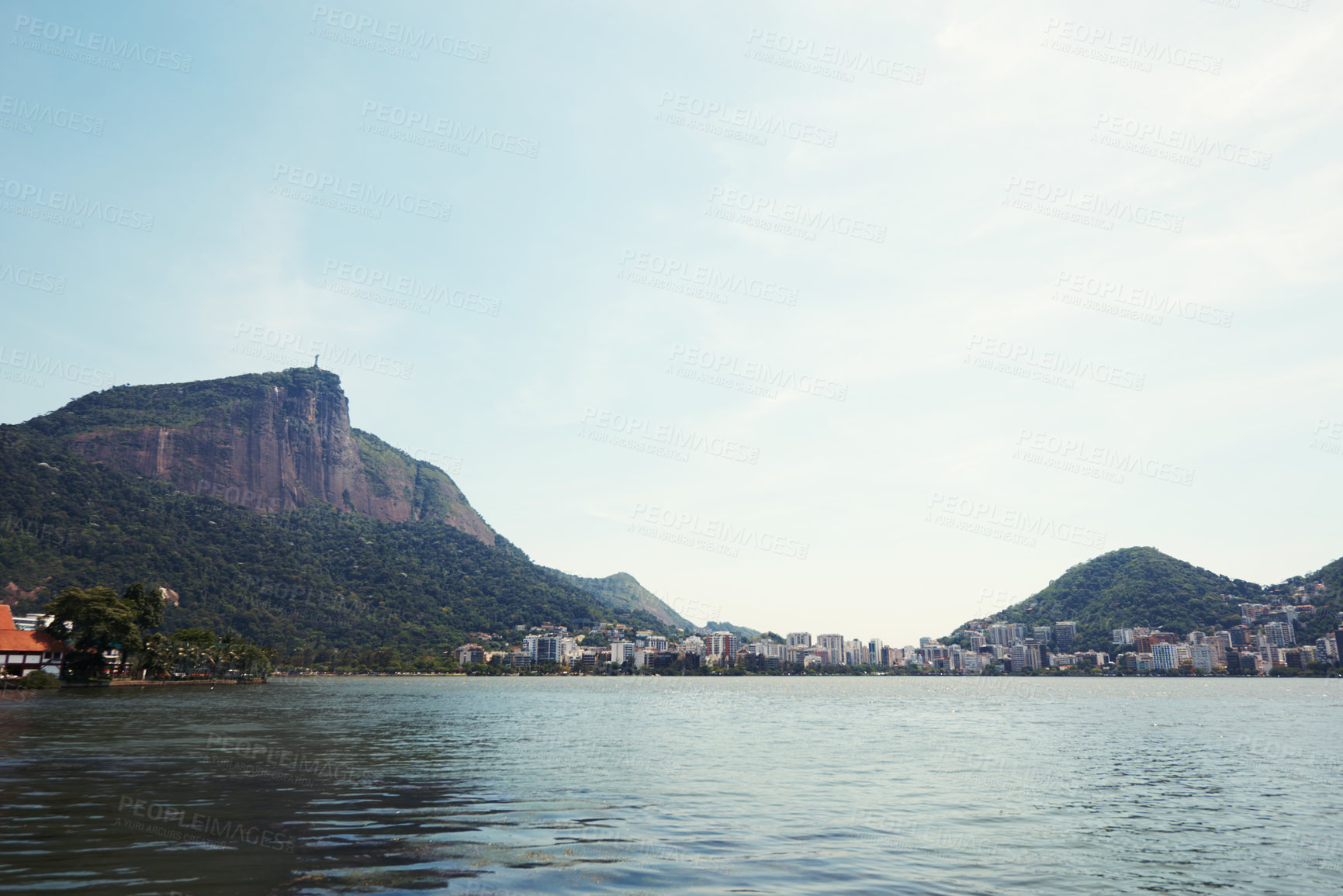 Buy stock photo Cropped shot of a city on the coastline with mountains surrounding it