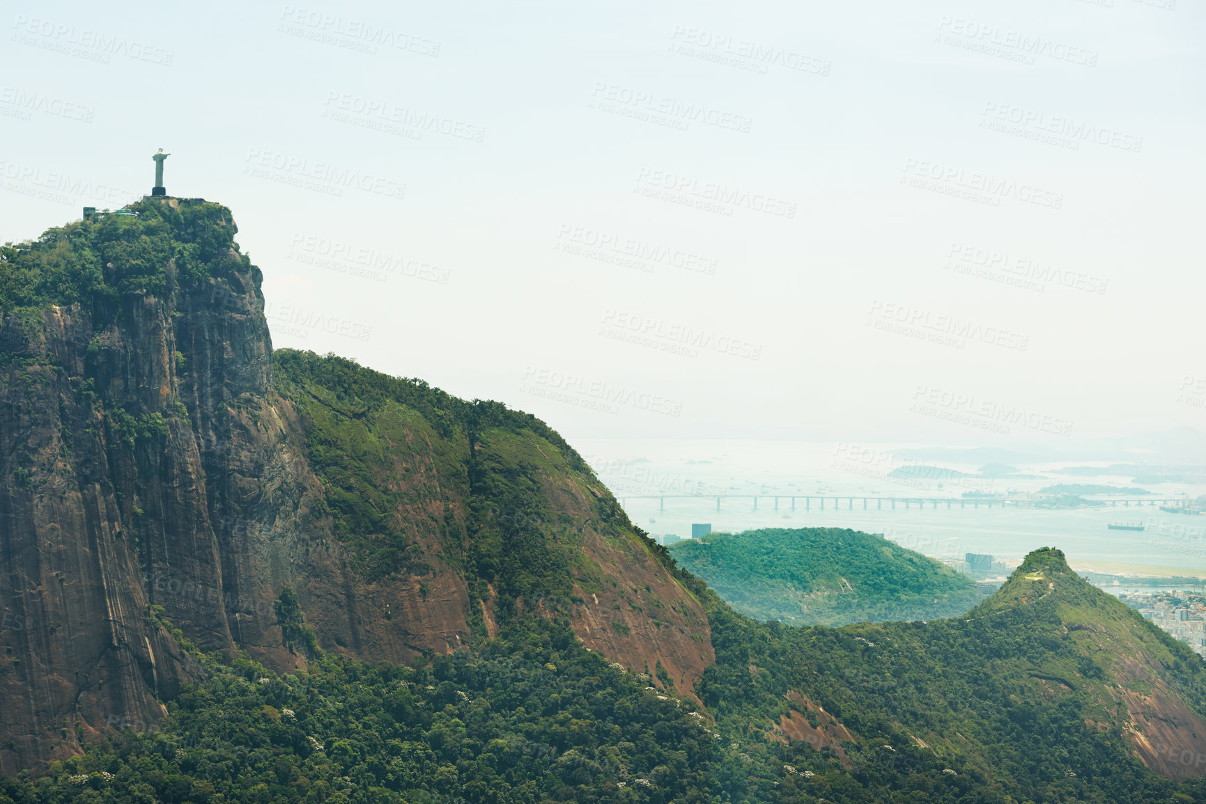 Buy stock photo Mountain, nature and Christ the Redeemer in Brazil for tourism, sightseeing and travel destination. Landscape, Rio de Janeiro and drone view of statue, sculpture and landmark on hill background