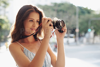 Buy stock photo Happy woman, photography and city street with camera for photo, memory or capturing outdoor moment. Female person, tourist or photographer taking picture with lens for sightseeing in an urban town