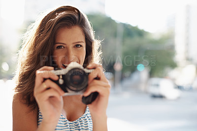 Buy stock photo Cropped shot of an attractive young woman in an urban setting