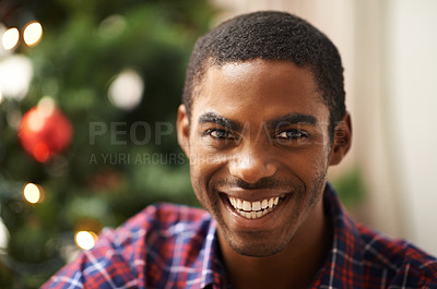 Buy stock photo Man, portrait and smile in home on christmas for celebration, holiday and festive spirit in living room. African person, face and happy on xmas with relax, confidence and vacation in lounge of house