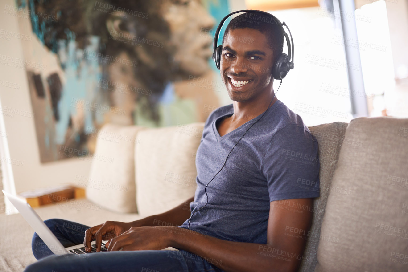 Buy stock photo Man, portrait or radio with laptop on sofa for internet streaming, happiness or online research with music. Student, black person or technology with headphones for relax, studying or learning in home