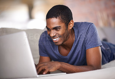 Buy stock photo Home, relax and black man with laptop, typing and connection with email and internet. African person, apartment and guy with technology and computer with website information, smile and online blog