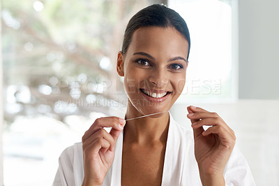 Buy stock photo Happy woman, flossing and dental for teeth whitening, mirror or reflection in bathroom for morning routine. Oral hygiene, wellness and orthodontics with thread for fresh breath, health and self care