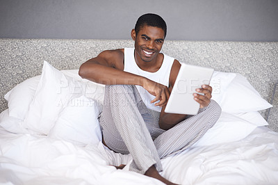 Buy stock photo Happy black man, portrait and bed with tablet in social media, communication or online entertainment at home. African male person with smile for technology, networking or browsing in bedroom at house