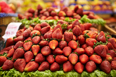 Buy stock photo A display of delicious red strawberries at a food market