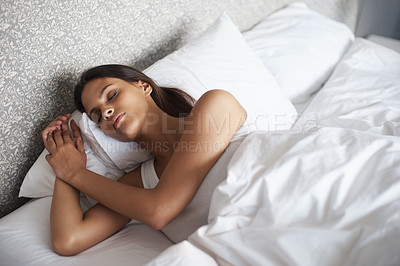 Buy stock photo Woman, sleep and bed for stress relief, dream and self care as wellness in hotel room in Atlanta. Mental health, female person and eyes closed on pillow for calm, sleeping and rest in bedroom