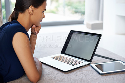 Buy stock photo Laptop, research and remote work with woman on floor of living room in home for thinking or planning. Technology, internet and report with young freelance employee in apartment for administration