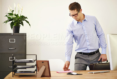 Buy stock photo Desk, letter and confused business man with briefcase in office looking worried for employment. Anxiety, doubt or frown and young employee with glasses in professional workplace for notification
