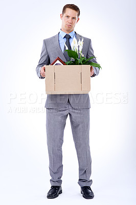 Buy stock photo Businessman, suit and box for resignation, fired or transfer at company for liquidation on white backdrop. Employee, worker and sad person for organization loss, fraud and turnover with memorabilia 