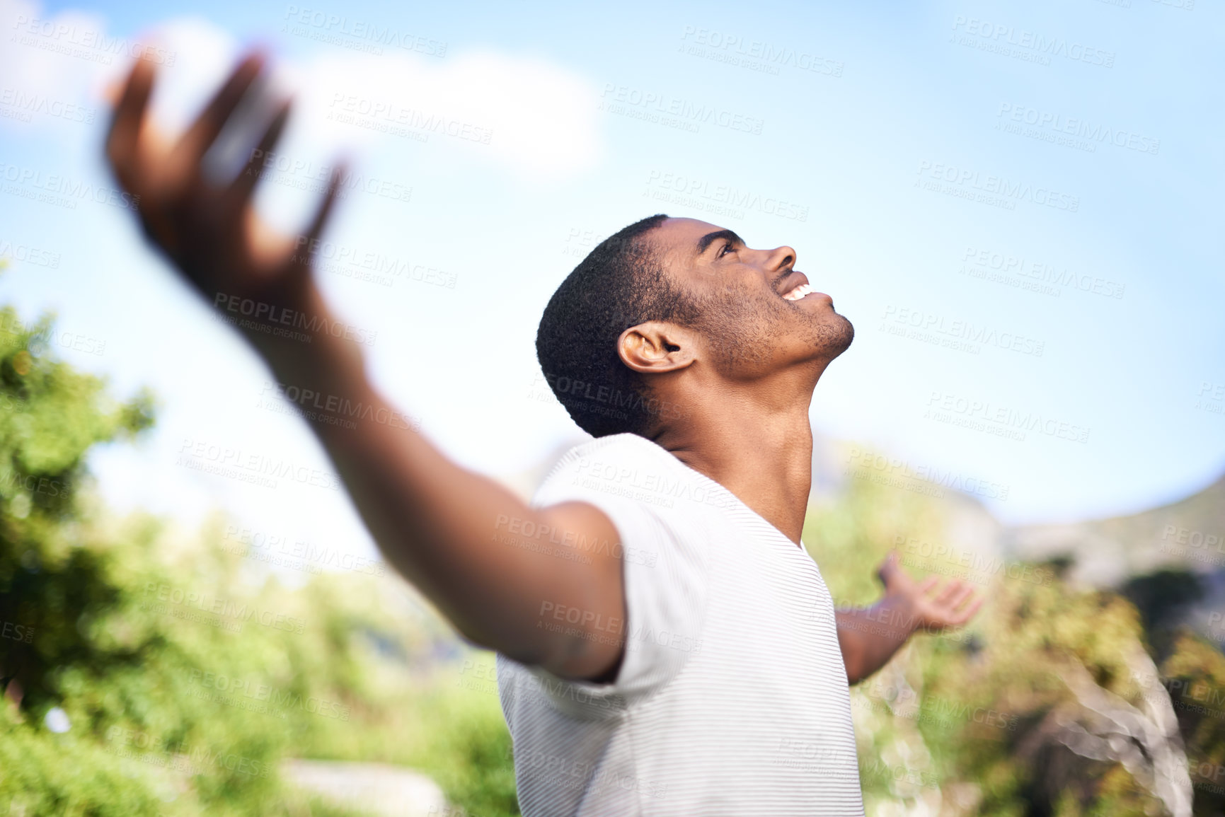 Buy stock photo Face, smile and freedom with black man in garden of home on blue sky for summer freedom or fresh air. Thinking, motivation and inspiration with happy young person hands raised outdoor in backyard