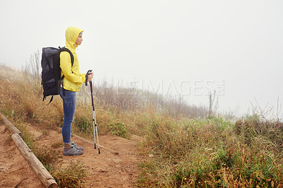 Buy stock photo Hiking woman, fog and exercise for cardio, walking stick and activewear for fitness. Backpack, adventure or mountain trail with morning overcast, sport or female athlete in nature and resting 