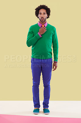 Buy stock photo Fashion, black man and studio with colorful clothes in yellow background for trendy, style and outfit. Male person, stylist and elegant for season trends with funky, formal wear and edgy look.