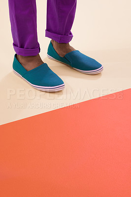 Buy stock photo Male model, shoes and footwear for fashion, floor and feet with mock up space and colourblock background. Contemporary, stylish and trendy for black man person, classic or comfortable sneaker design