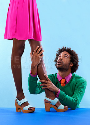 Buy stock photo Couple, studio and retro with color, fashion and love with relationship and begging. African man, woman and dating with funky, vivid and bright contrast with breakup or confession on blue background