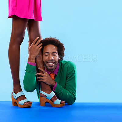 Buy stock photo Couple, studio and smile with color, fashion and love with relationship and begging. African man, woman and dating with funky, vivid and bright worship with vintage or confession on blue background