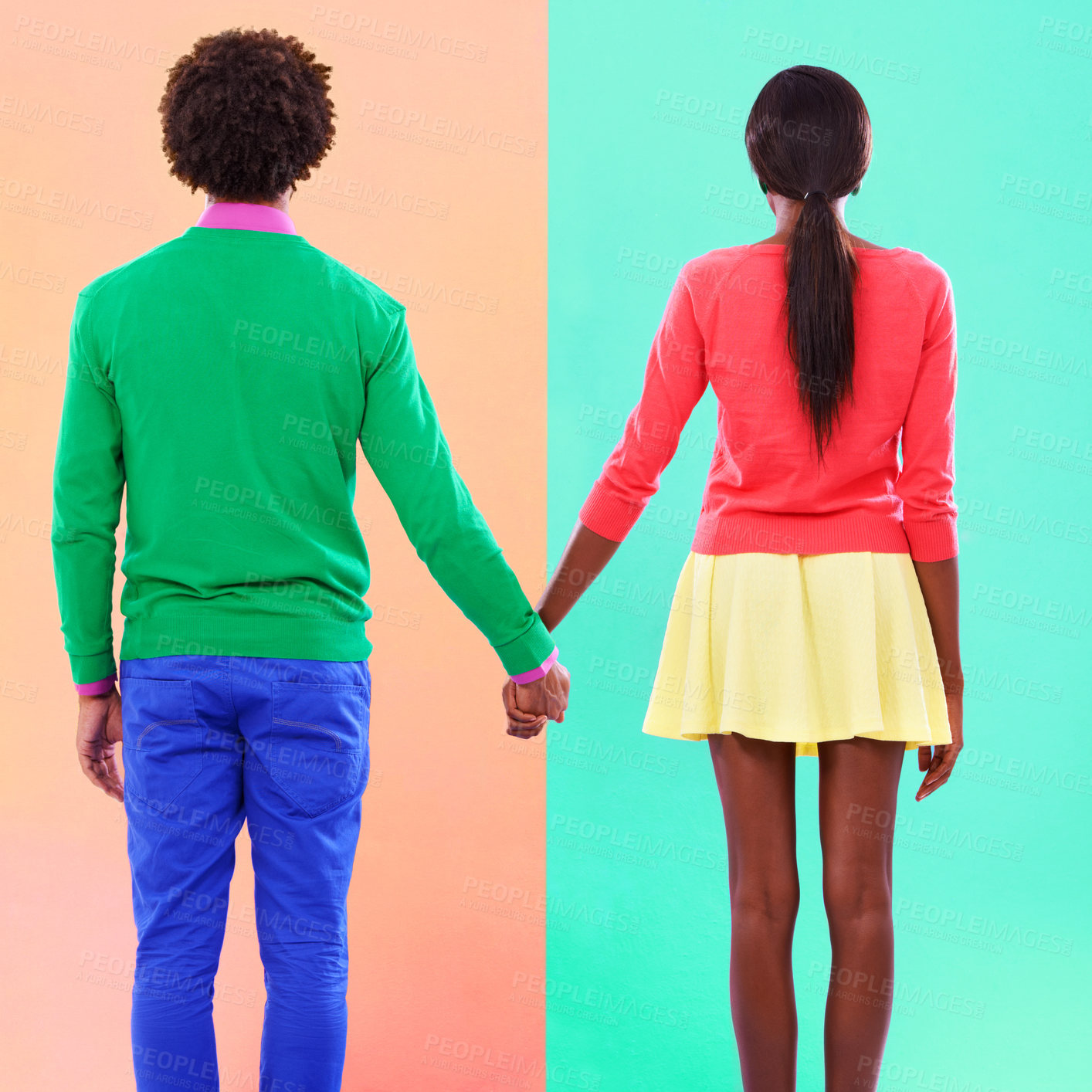 Buy stock photo Couple, back and holding hands with fashion in studio, background and creative aesthetic. Together, woman and man with colorful style, unique clothes or people with support or trust in mockup space