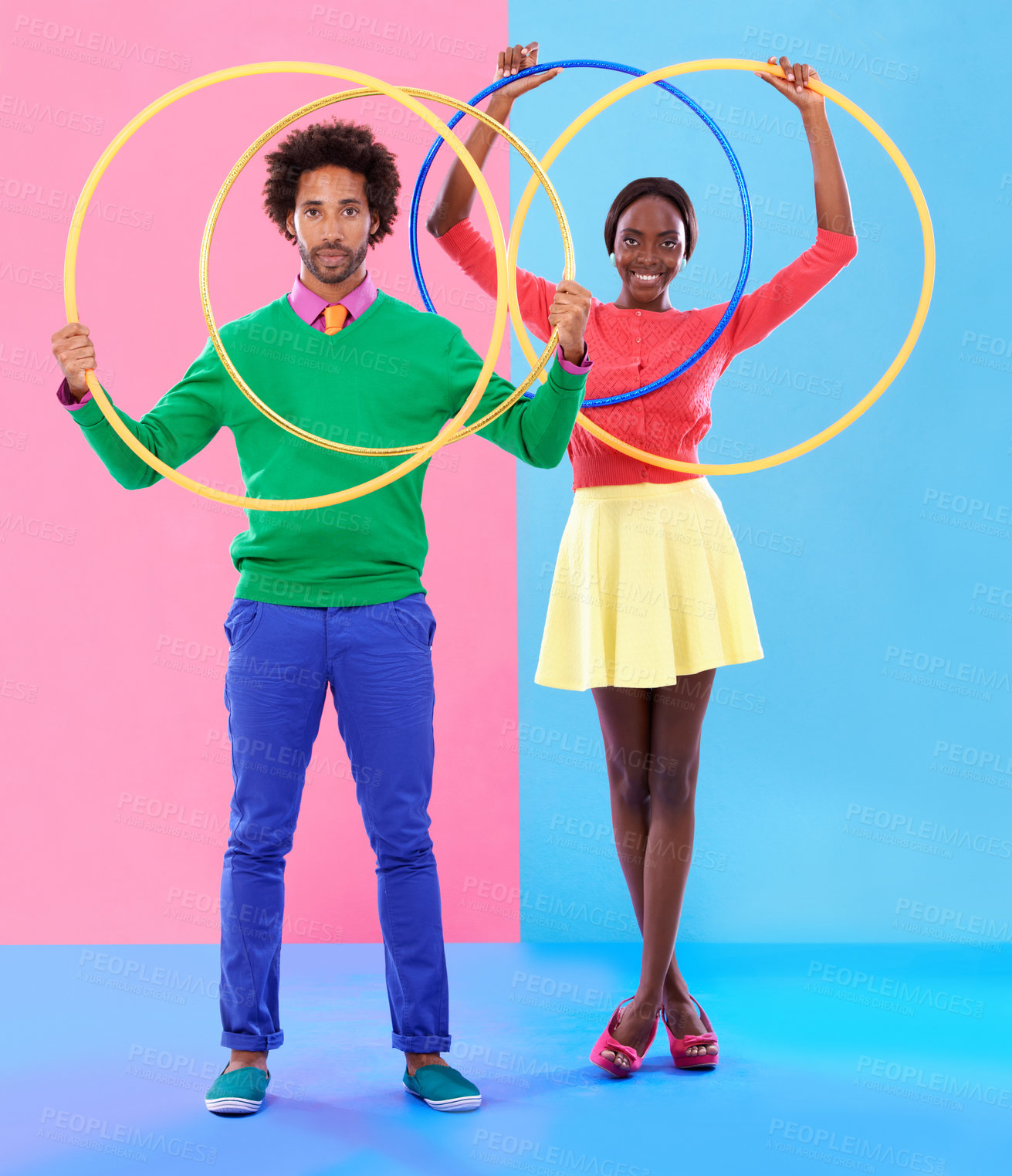 Buy stock photo People, smile or hoop for fashion, casual or spring outfit for playful aesthetic on color block background. Portrait, man or woman for plastic toy in funky, colorful or stylish clothing in studio