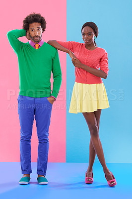 Buy stock photo Confused, couple and portrait with fashion in studio, background and creative aesthetic. Doubt, question and woman with support of man and together with colorful retro style and unique clothes mockup