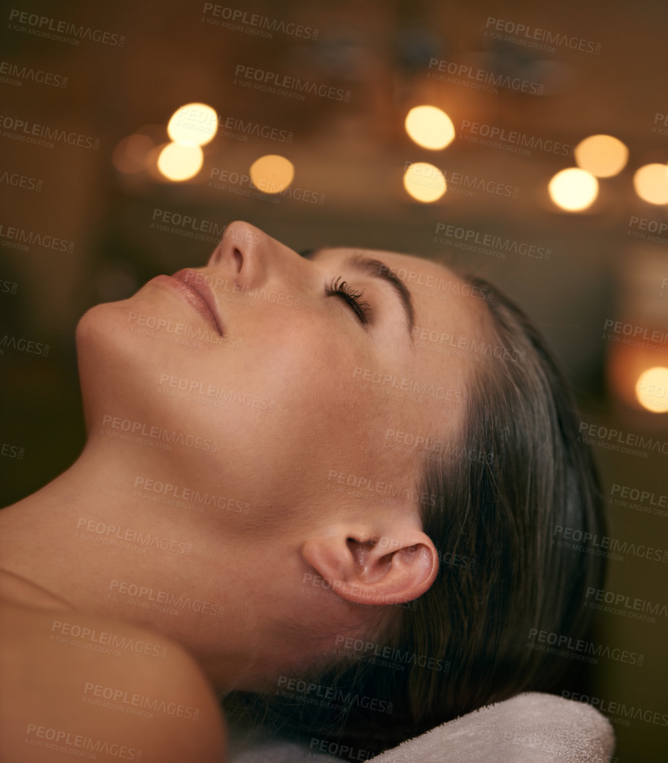 Buy stock photo Woman, spa and candle with luxury, relax and peace with wellness and bokeh. Person, skincare and health for zen, calm and body care at resort or massage parlour and serene ambience and treatment