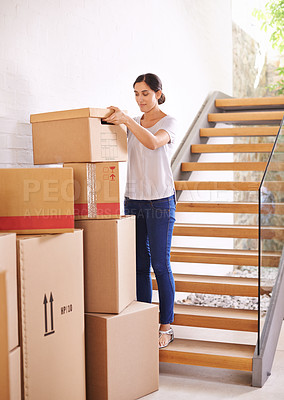 Buy stock photo Woman, new home and moving boxes for property investment, rental apartment or real estate loan. Smile, tenant and female person carrying cardboard package for logistics, relocation or renovation.