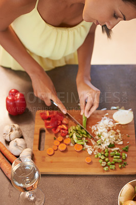 Buy stock photo Chef, food and health with woman in kitchen of home to prepare meal for diet or nutrition from above. Cooking, nutritionist or vegan and person cutting green vegetables with knife in apartment