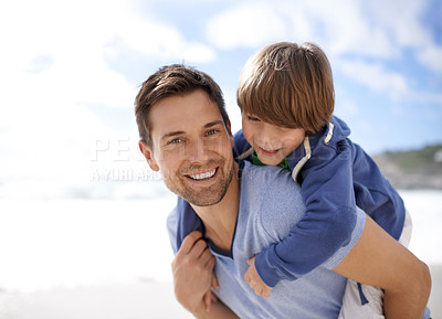 Buy stock photo Father, child or family at beach for portrait, travel or holiday in summer with a smile for piggy back fun. A man and kid or son playing together on vacation at sea with a blue sky and happiness