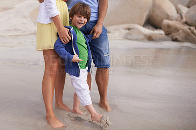 Buy stock photo Happy, kid and parents on the beach in summer, holiday or vacation with family in Florida. Excited, child and feet relax in sand together with mom and dad at ocean or sea for adventure in Miami