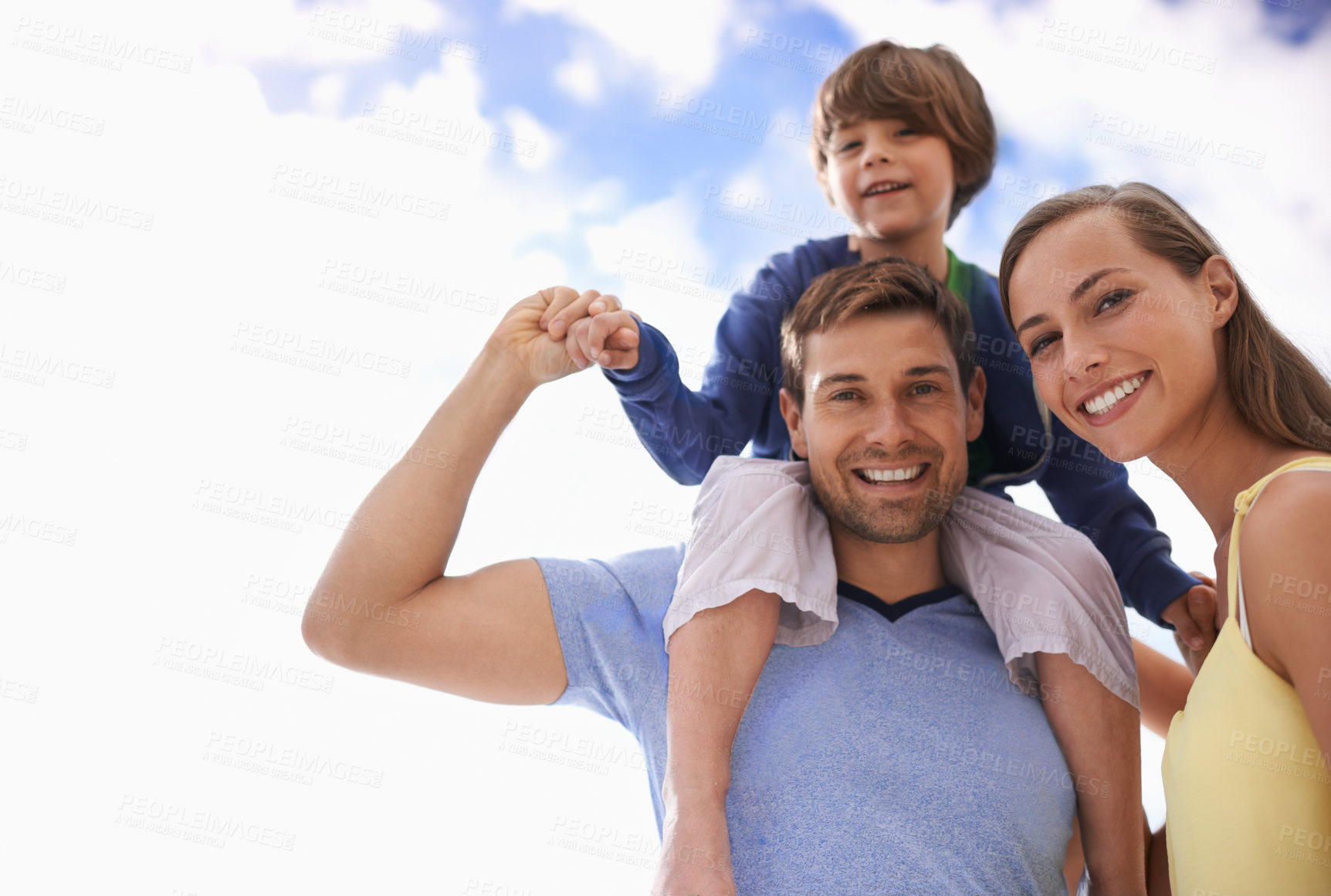 Buy stock photo Portrait of a happy couple with their son in the outdoors