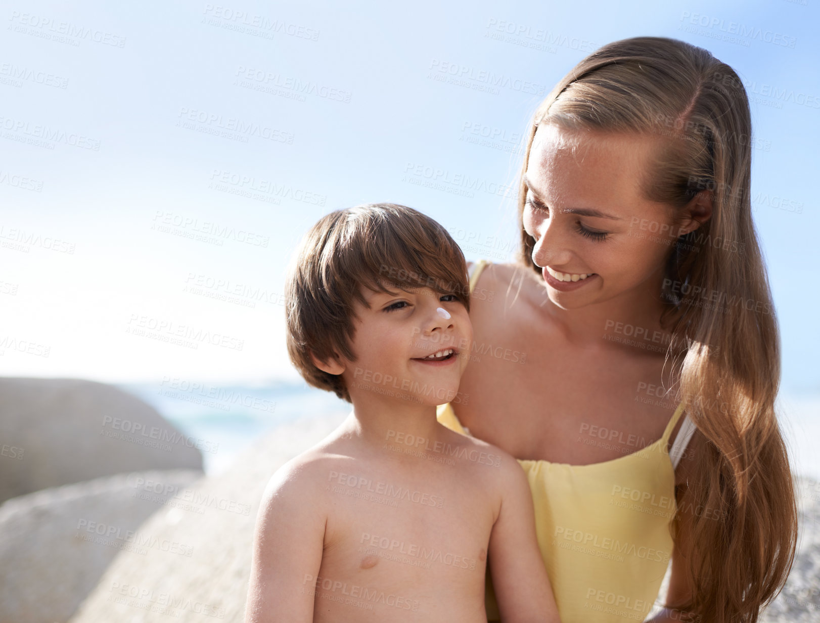 Buy stock photo Child, mother or family at beach with sunscreen on nose for sun protection on travel holiday in summer. A woman and kid happy together on vacation at sea with blue sky, skincare lotion and happiness