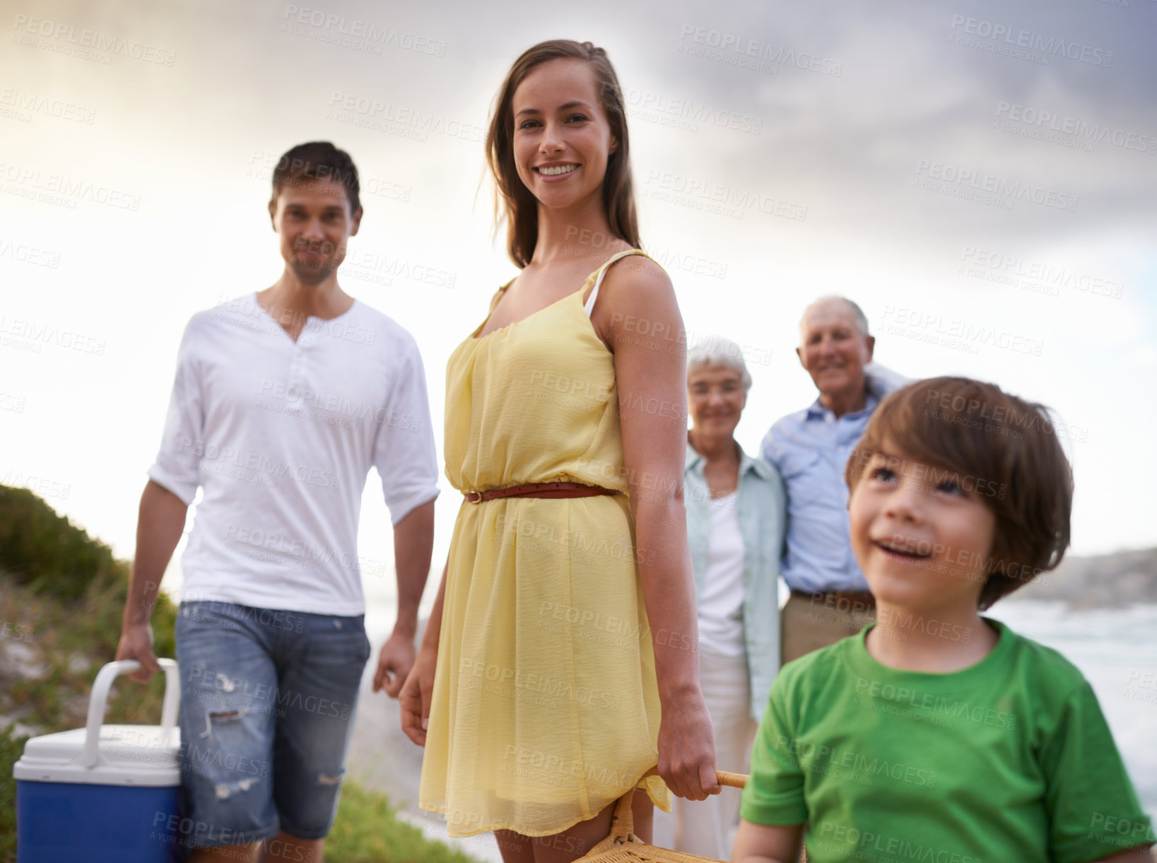 Buy stock photo Portrait, picnic and family on beach for vacation, adventure and tropical holiday in Australia. Grandparents, parents and happy face of boy child at ocean with sunshine, weekend and smile in summer.