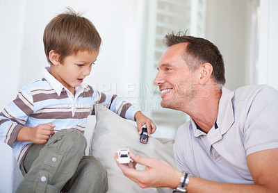 Buy stock photo Portrait of a happy father playing with his son