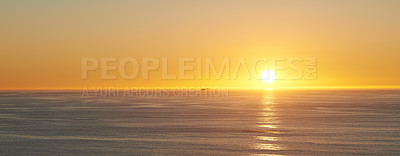Buy stock photo Orange sky, sunset and sea at morning on the horizon with ocean and waves landscape. Sunrise background, calm weather and summer by beach with coastline and outdoor environment with sun and mockup