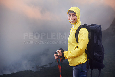 Buy stock photo Woman, hiking and portrait with trekking sticks, winter and support for fog trail in mountain. Athlete, backpack and happy face with gear for safety, clouds and walking for fitness wet environment