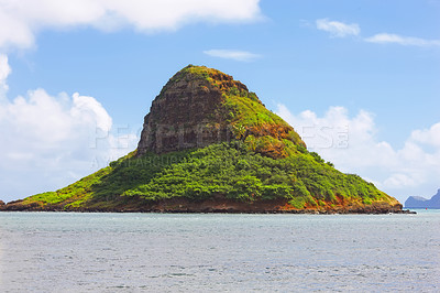 Buy stock photo Mountain, island and natural landscape with blue sky, summer and calm clouds on peak at travel location. Nature, cliff and sustainable environment with earth, drone and tropical holiday destination