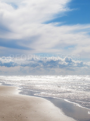 Buy stock photo Beach, clouds and blue sky by the ocean for travel with a seascape or tropical vacation in Australia. Nature, island and sea water waves with sand for an outdoor paradise holiday or weekend trip.