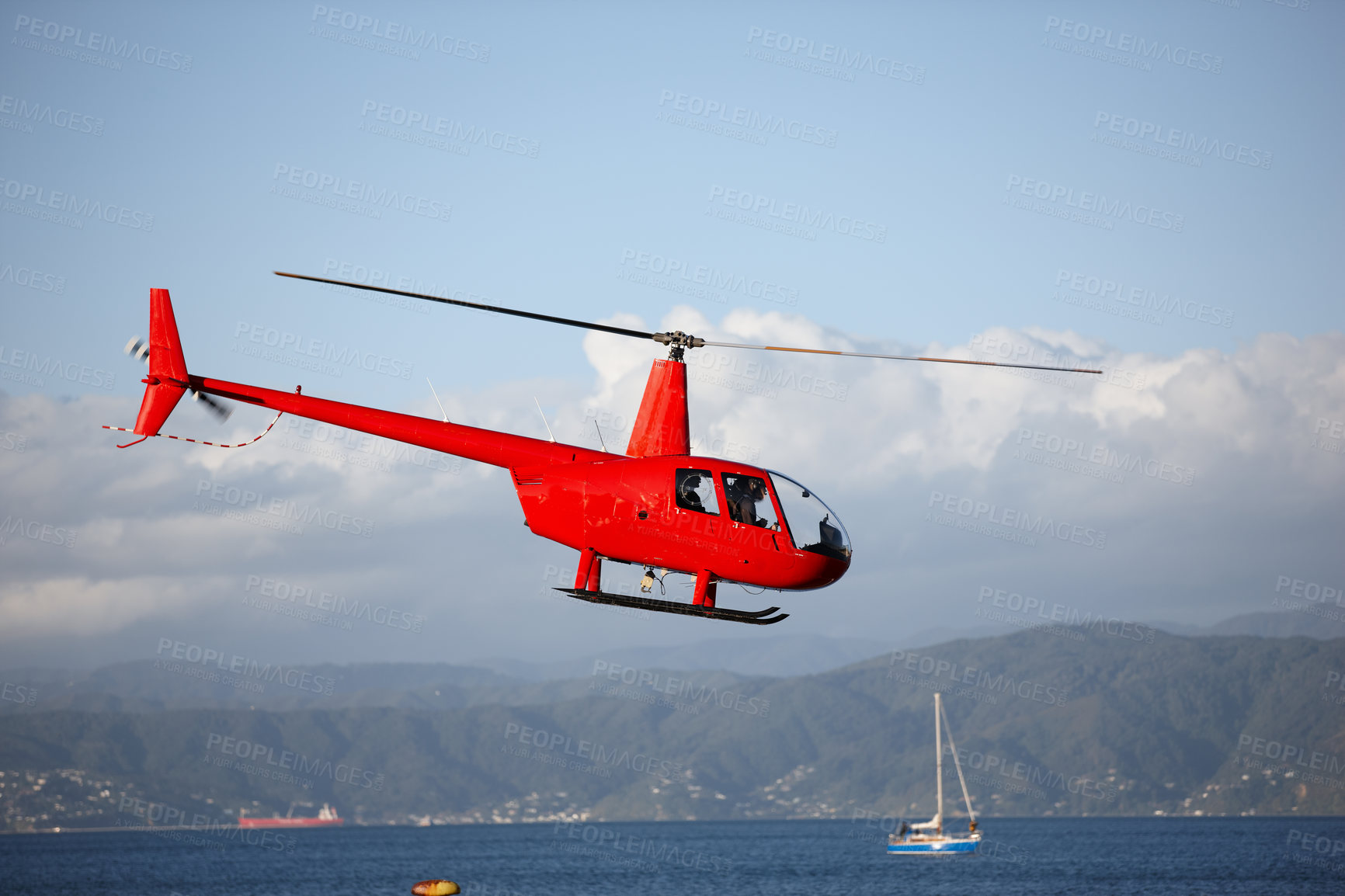 Buy stock photo Helicopter, sea and emergency transport or landscape for search and rescue, medical service or patrol in sky. Chopper, aerial view and ocean environment for help on mountain, coast guard or lifesaver