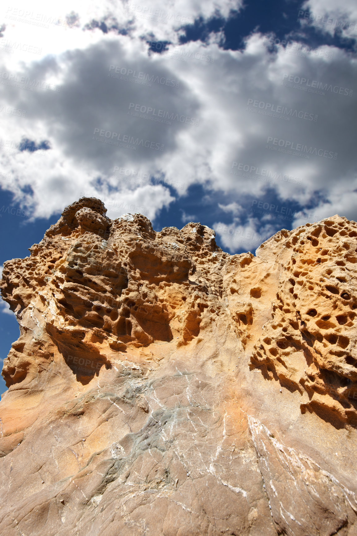 Buy stock photo Mountain, rocks and natural landscape with cloudy sky, summer and sunshine on peak at travel location. Nature, cliff and sustainable environment with earth, stone and tropical holiday in low angle