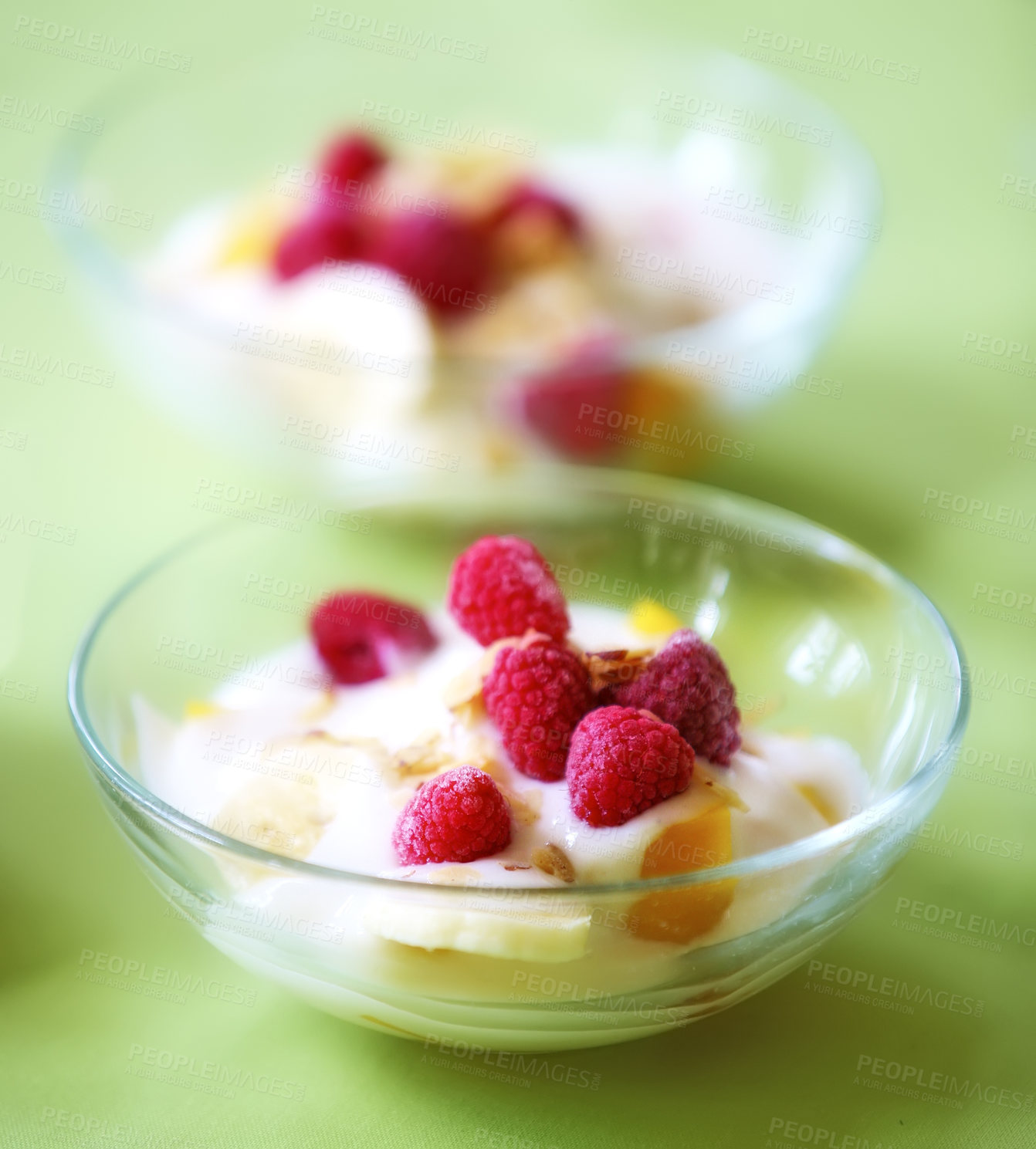 Buy stock photo A photo of dessert - raspberries, banana and cream