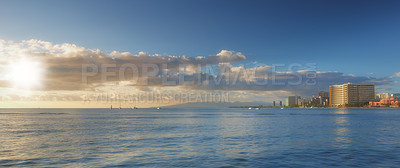 Buy stock photo Blue sky, ocean and clouds with city background for peace, nature and environment with skyline seascape of tropical beach. Calm water, sea and horizon with location for break or vacation with view