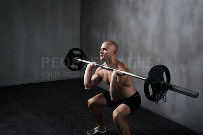 Buy stock photo Shot of a man working out with weights at the gym