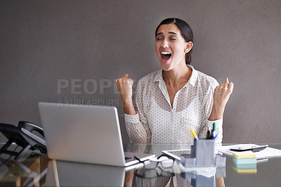 Buy stock photo Shot of a beautiful young woman celebrating at her laptop