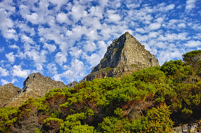 Buy stock photo Mountains, environment and blue sky with nature, summer and stone with landscape and weekend break. Empty, rock and grass with flowers and countryside with spring and travel with holiday or sunshine