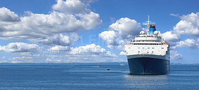 Buy stock photo A cruise ship sailing towards its destination on a sunny afternoon