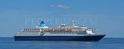 Buy stock photo A cruise ship sailing towards its destination on a sunny day